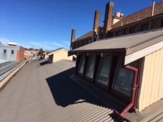 Gutter-Vac Orange – Gutter Clean and Roof Top Windows Cleaned for Commercial Clients.